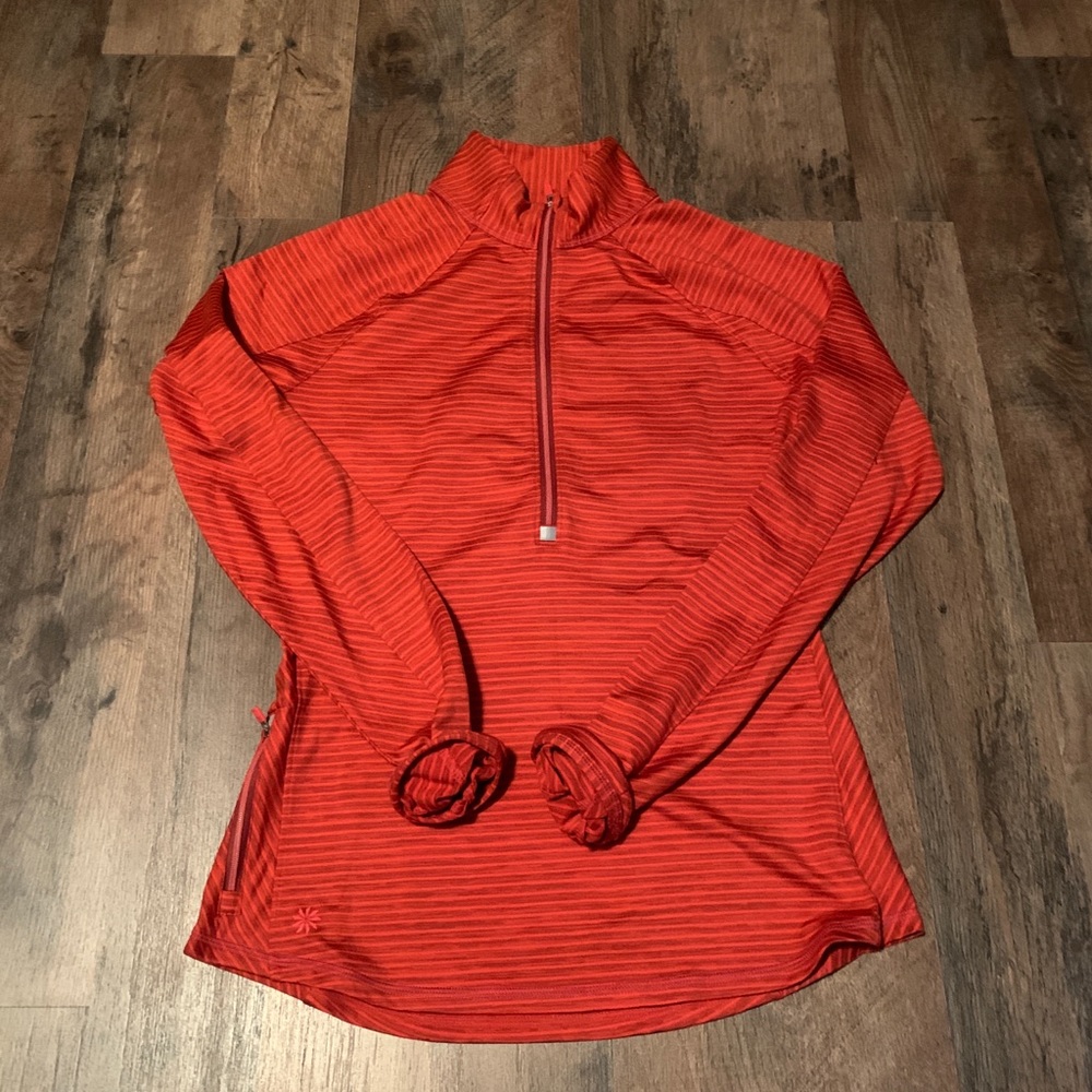 Striped, red-orange Athleta zip up. Size small.